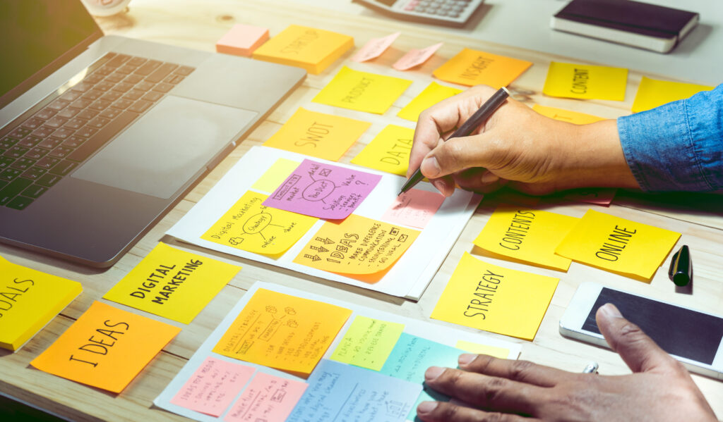 businessman working with notepaper of strategy ideas.Business co