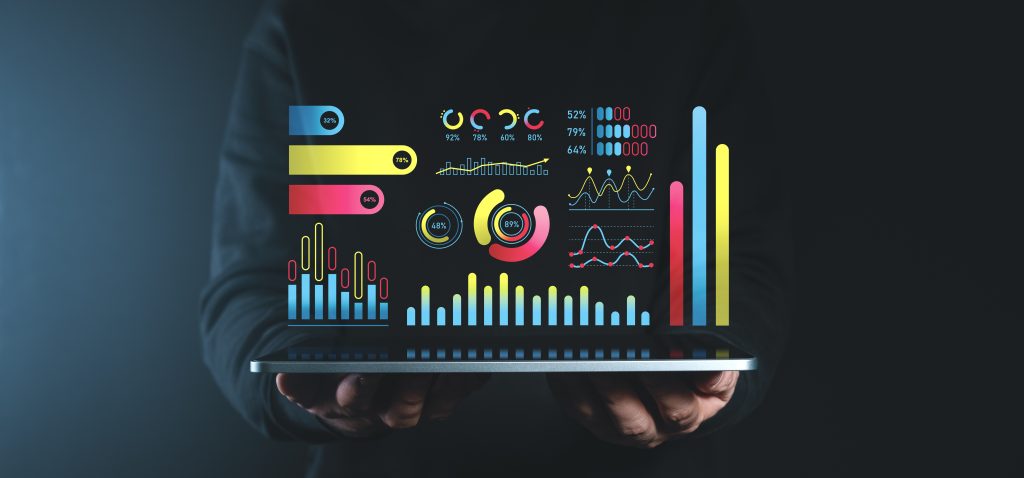 Interactive holographic business data charts and graphs on dark background.